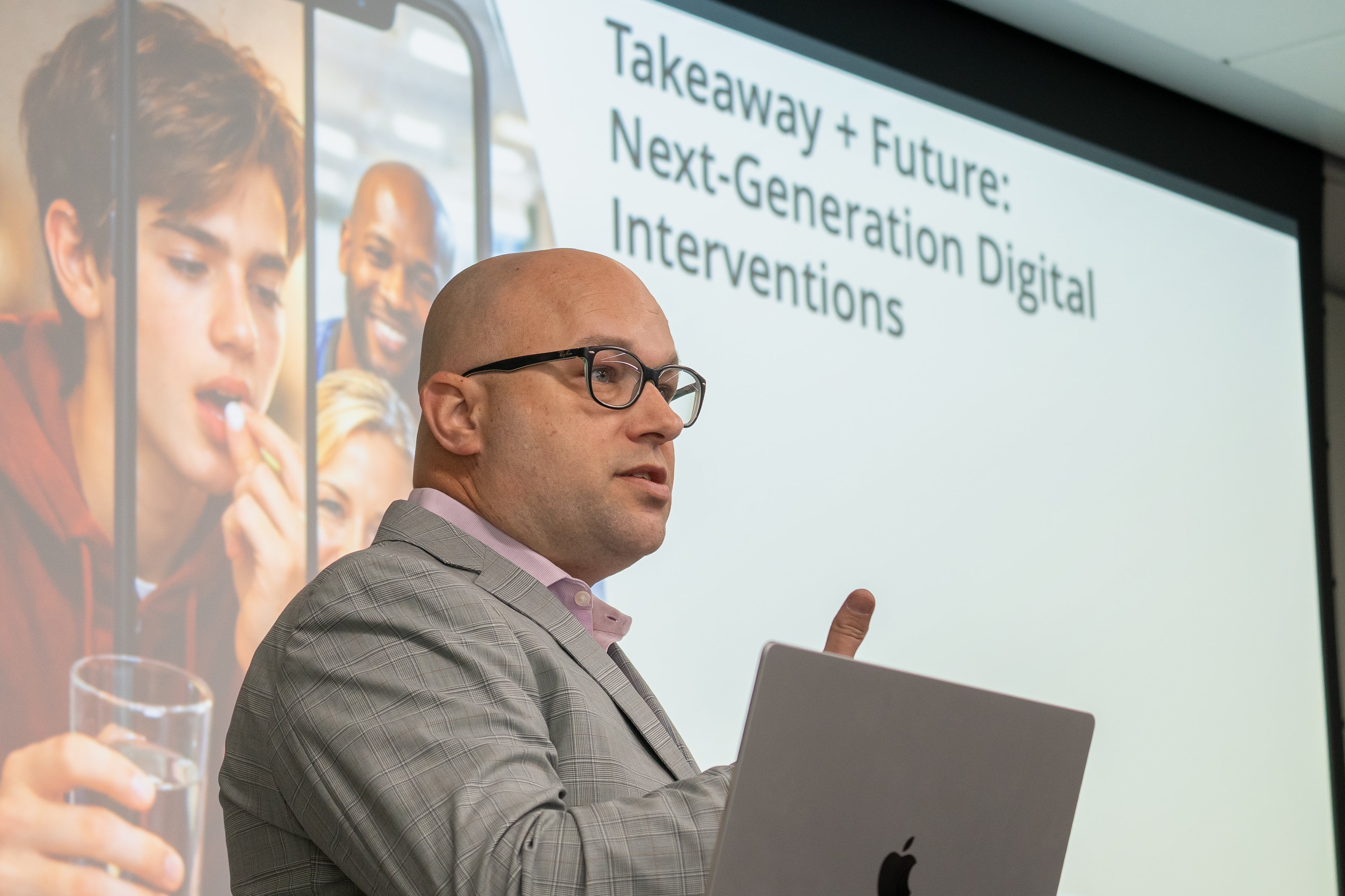 A picture of Dr. Michael Killian presenting during a breakout session on the Takeaway and Future of Next-Generation Digital Interventions.