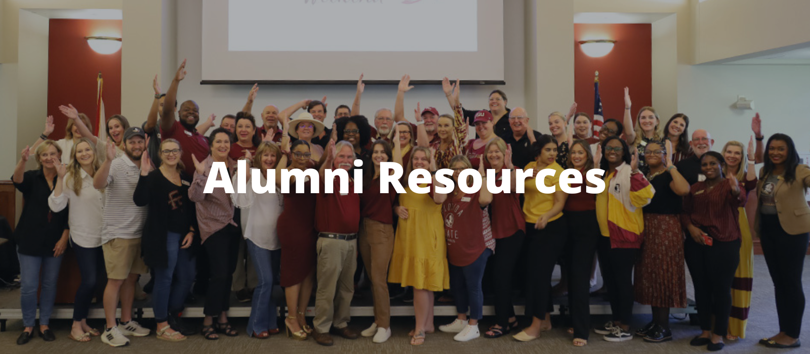 "Image of Florida State University alumni raising their arms in a group at the FSU Alumni Association""