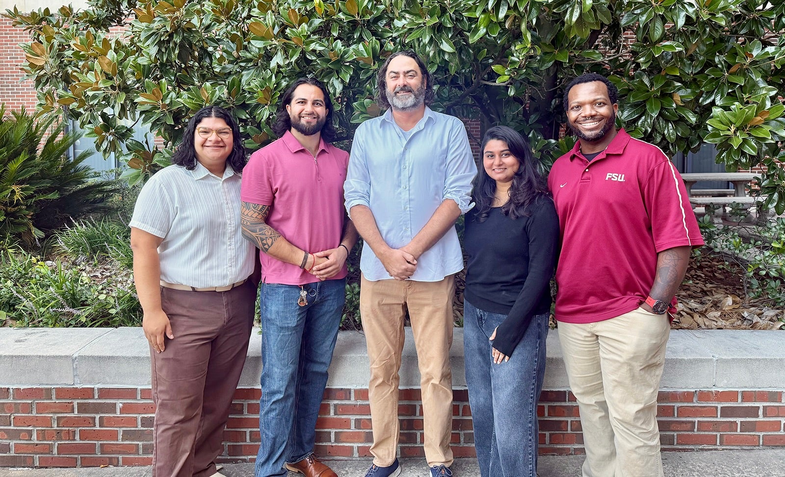 2026 doctoral cohort including Pedro Serrano Mejia, Russ Sharif, Sherin Thomas with Doctoral Program Dr. Stephen Tripodi and Kam Green.