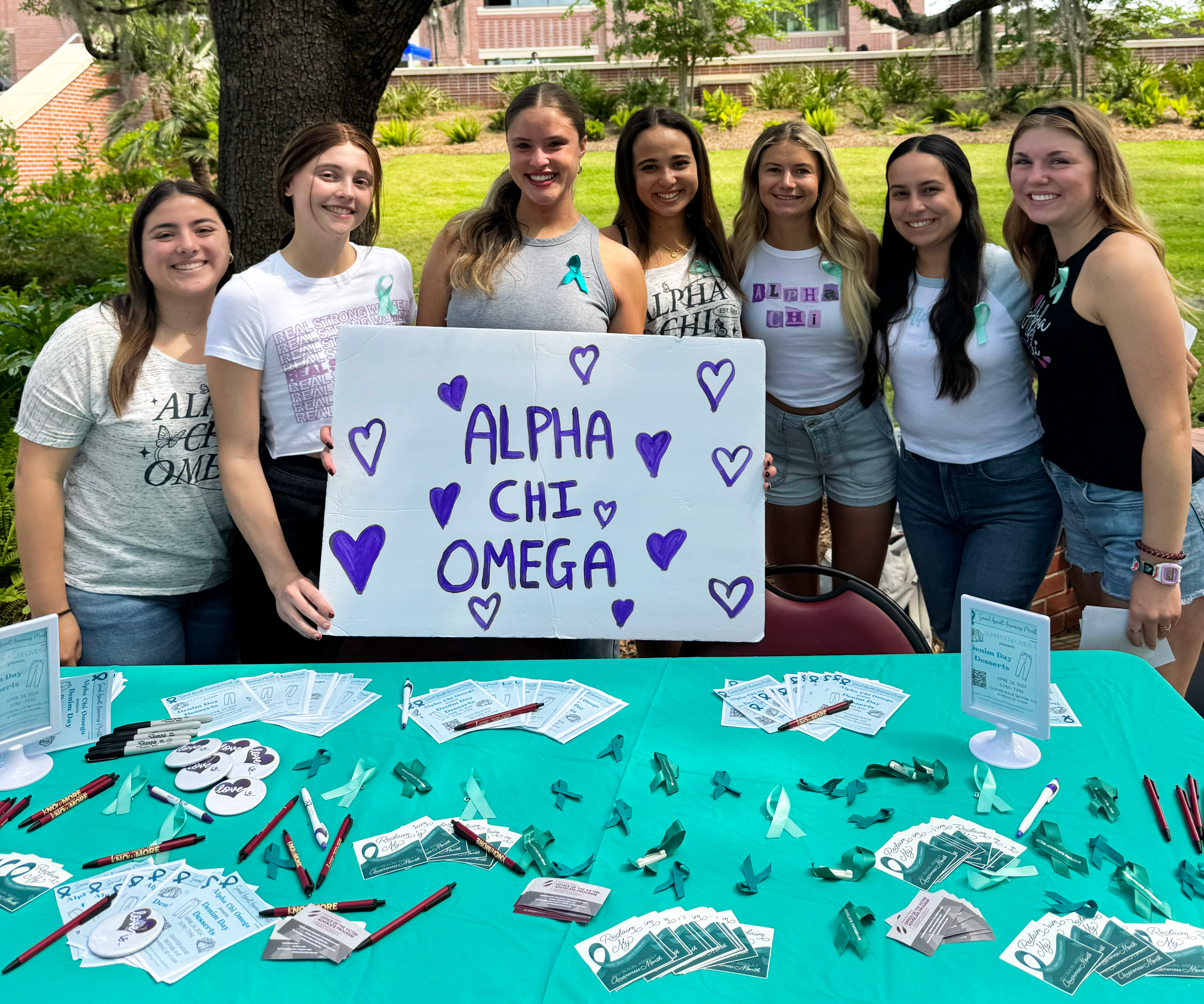"Claire Sciandra (Center) and Alpha Chi tabling at FSU for Healthy Relationships Week."