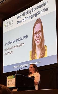 "Dr. Annelise Mennicke speaking at the 2026 Society for Social Work and Research Annual Program Meeting accepting her Social Policy Researcher Award"