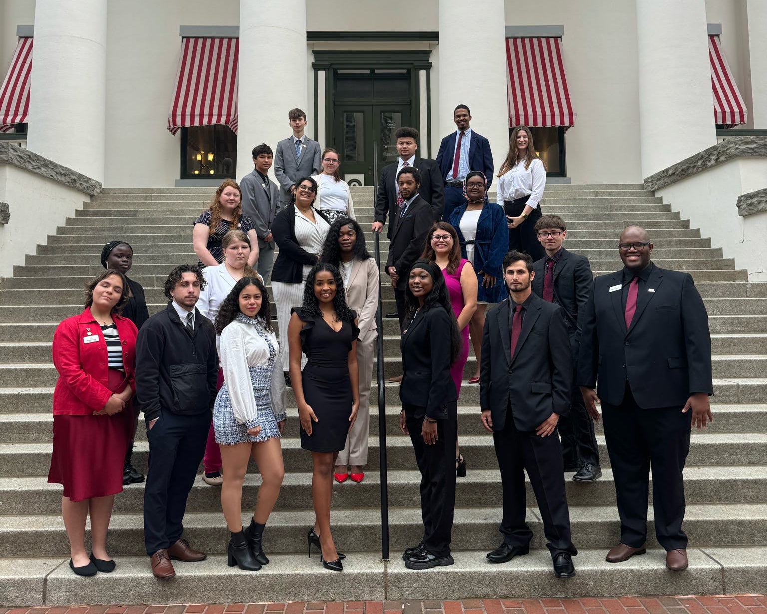 "Florida Youth SHINE peers and leadership pose in front of Florida's Old Capitol building."