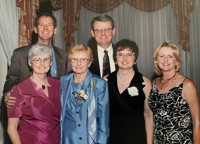"Photo of the Garvey Family with Jean Garvey second from the left surrounded by her five adult children."