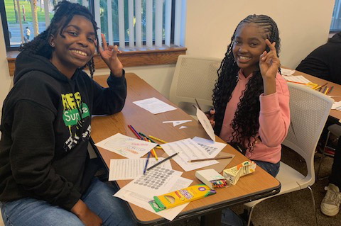 "Middle school students working on their poetry art"