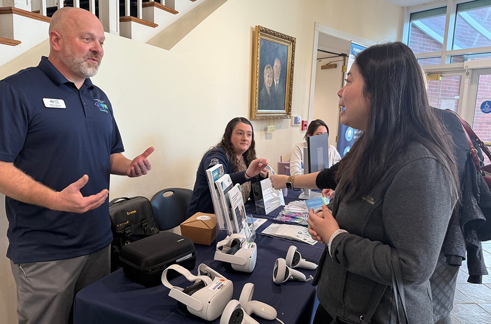 "Kyle Cook demonstrating and discussing Florida Institute for Child Welfare artificial intelligence tools."
