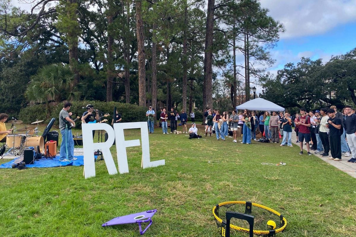 "FSU students visited Landis Green on Giving Tuesday to support fundraising efforts depicting a student band playing for a large crowd of students.