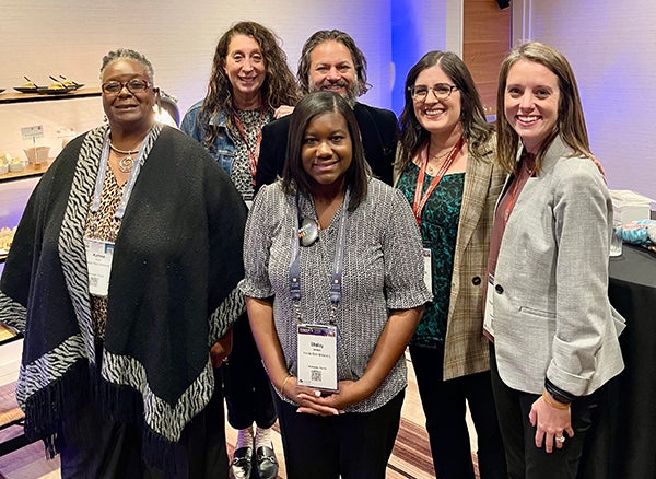 "Social Work Faculty Accepting MSWSN Award at CSWE Conference 2024"