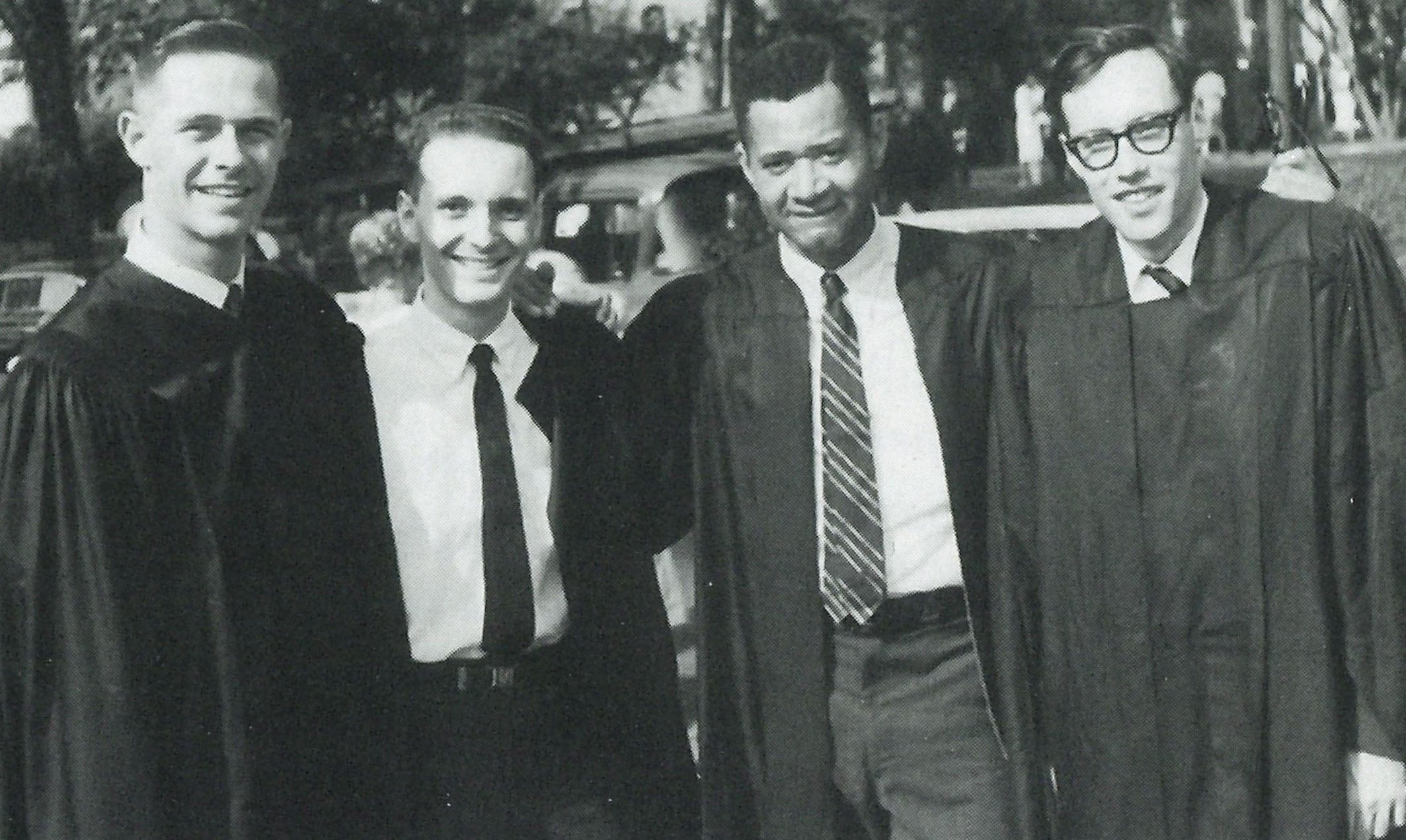 "Walter Hudson - left - with fellow University of Chicago graduates in 1963 in shirts and ties and graduation robes."