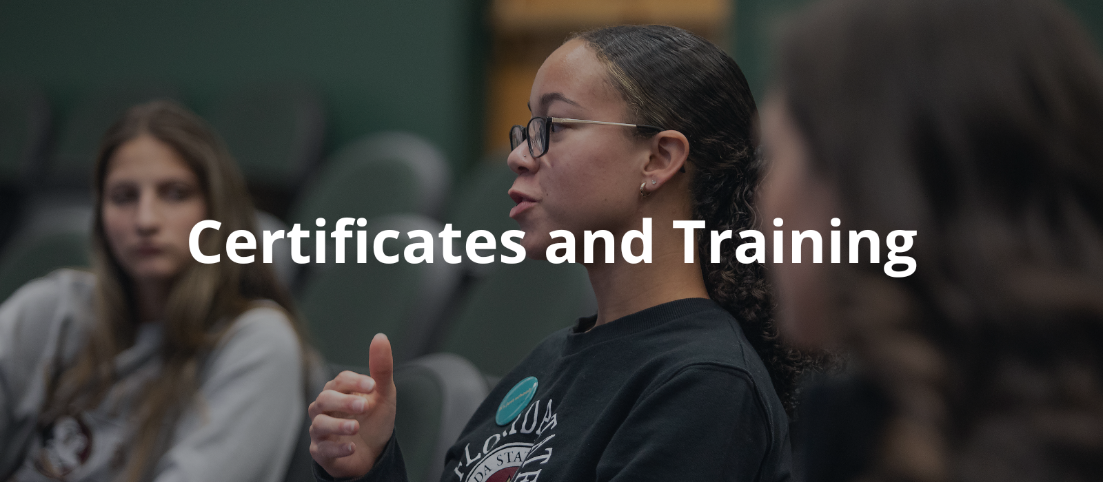 "Three women sitting in a room having a discussion"