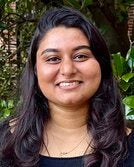 Headshot photo of Sherin Thomas.