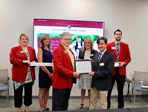 Tallahassee Chamber of Commerce Presenting a Certificate to the FSU Multidisciplinary Center.