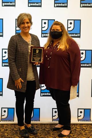 Ellen Piekalkiewicz accepting an award on behalf of the CFC Center