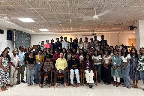 Group photo of workshop participants with John Mathias front and center