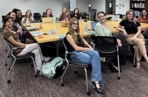 Fall 2025 Student Ambassadors seated at their first fall meeting in the Student Collaboration lab.