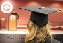 Student in Regalia Cap and Gown 