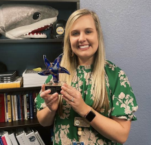 Kelsey Britten with her School Social Worker of the Year Award