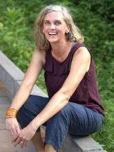 Photo of Kathleen McIntyre seated outside