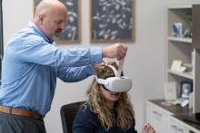 A person experiencing a virtual reality training offered by the Florida Institute for Child Welfare 