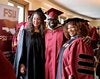 Student posing with faculty members Fran Gomory and Dr. Carol Edwards at the Spring 2026 graduation event.