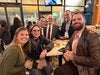 Dean Kirk Foster and Dr. Bruce Thyer centered posing with attendees at the Big Kahuna Atlanta reception.
