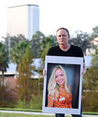 Jeff Binkley with a picture of Maura.