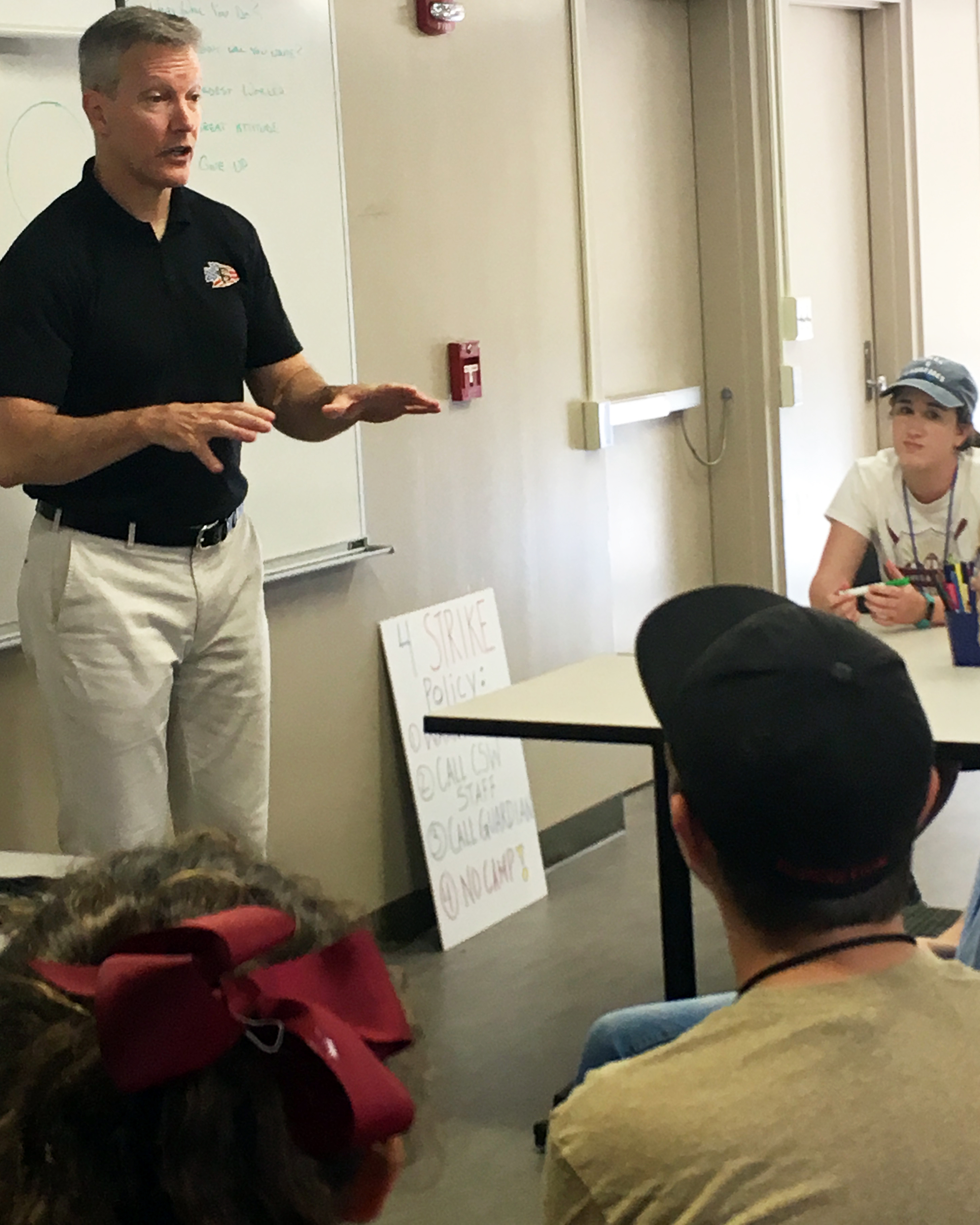 Colonel Billy Francis speaking with campers.