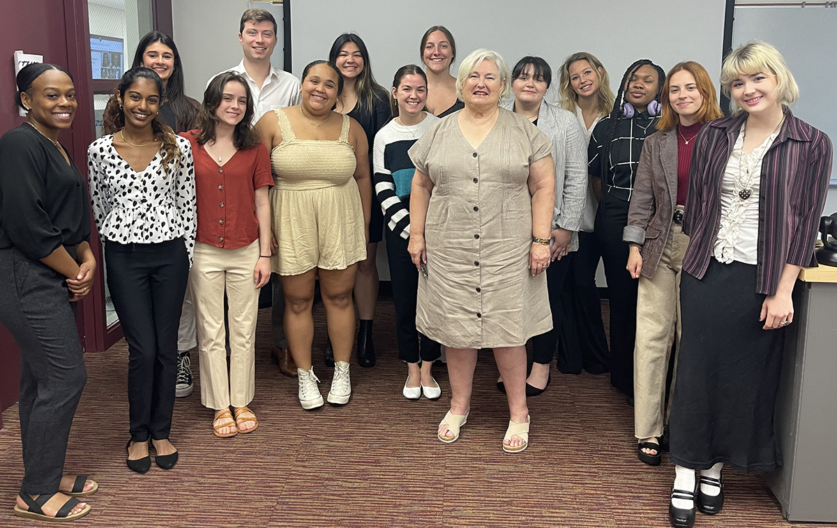 "Jean Munn poses with the students of her last Introduction to the Profession class."