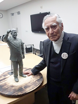 "Dr. Kapoor with a model of the future Mandela statue."