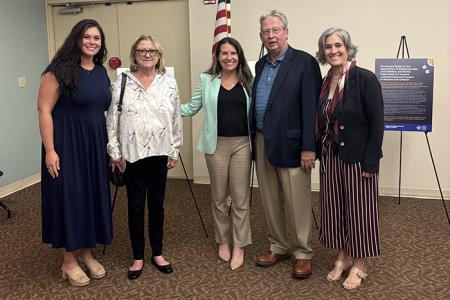 From left: Caroline Senkowicz, Aggie Stoops, Heather Howard, Jeff Stoops and Ellen Piekalkiewicz unveiled a traveling exhibit at the Palm Beach County Library highlighting the experiences of mothers impacted by substance use and child welfare involvement.